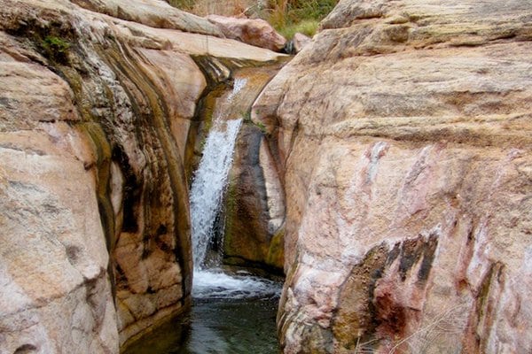The lower slot canyon falls can be found off the east side of the trail about 1 mile from the Colorado River.