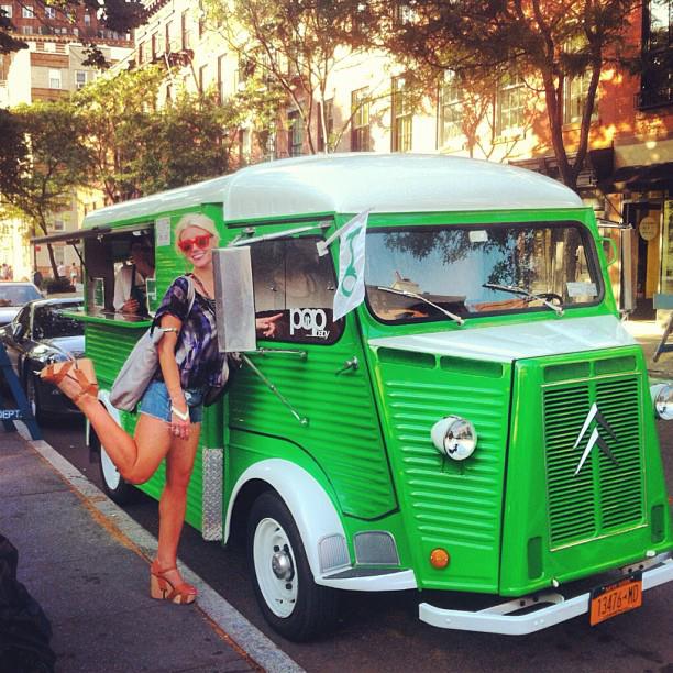 Michaela hits NYC's summer food trucks in her folding Wayfarers. Available at Sunglass Hut.
