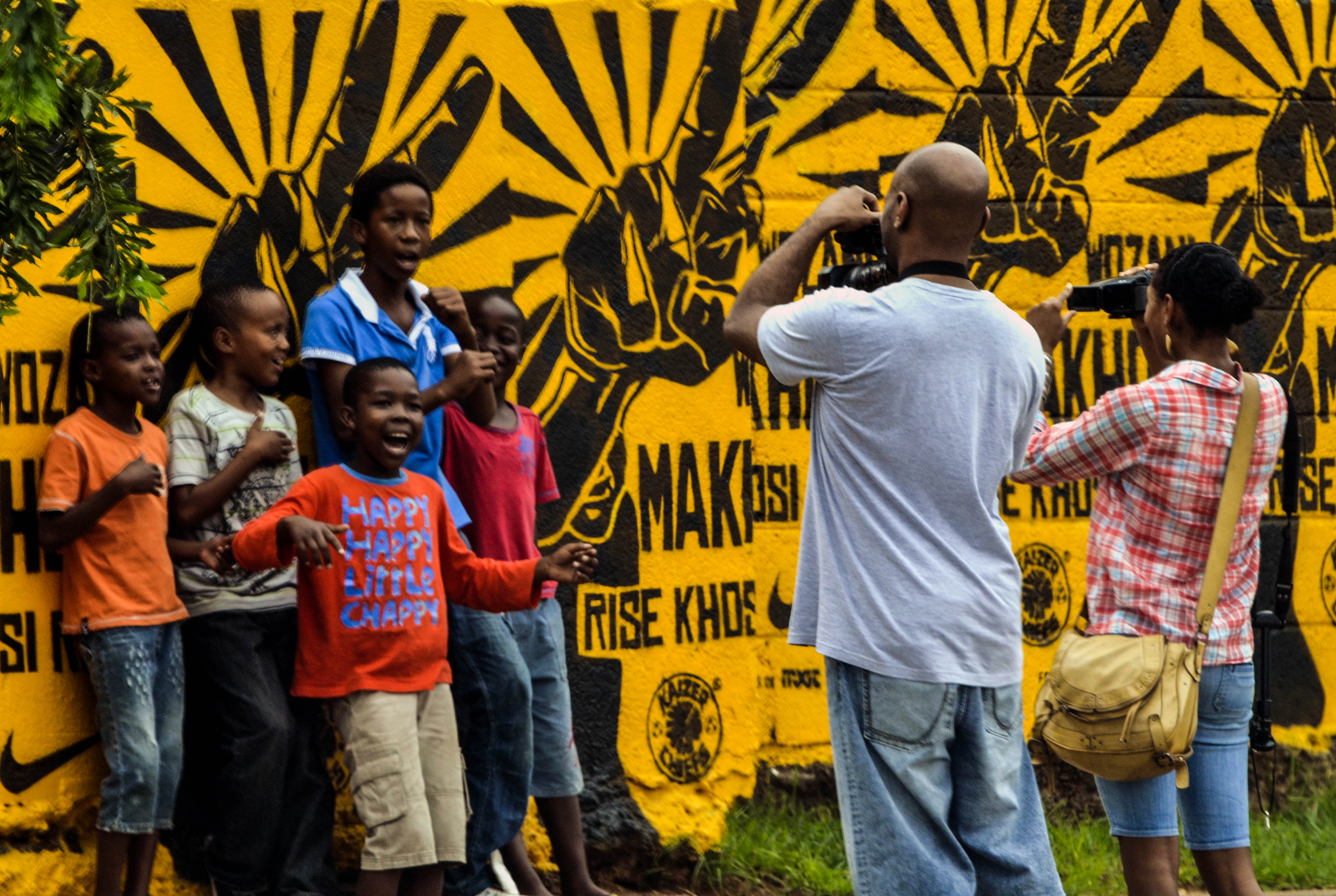 Snapping some photos of kids in SOWETO. Just be sure to show them the photos afterwards!