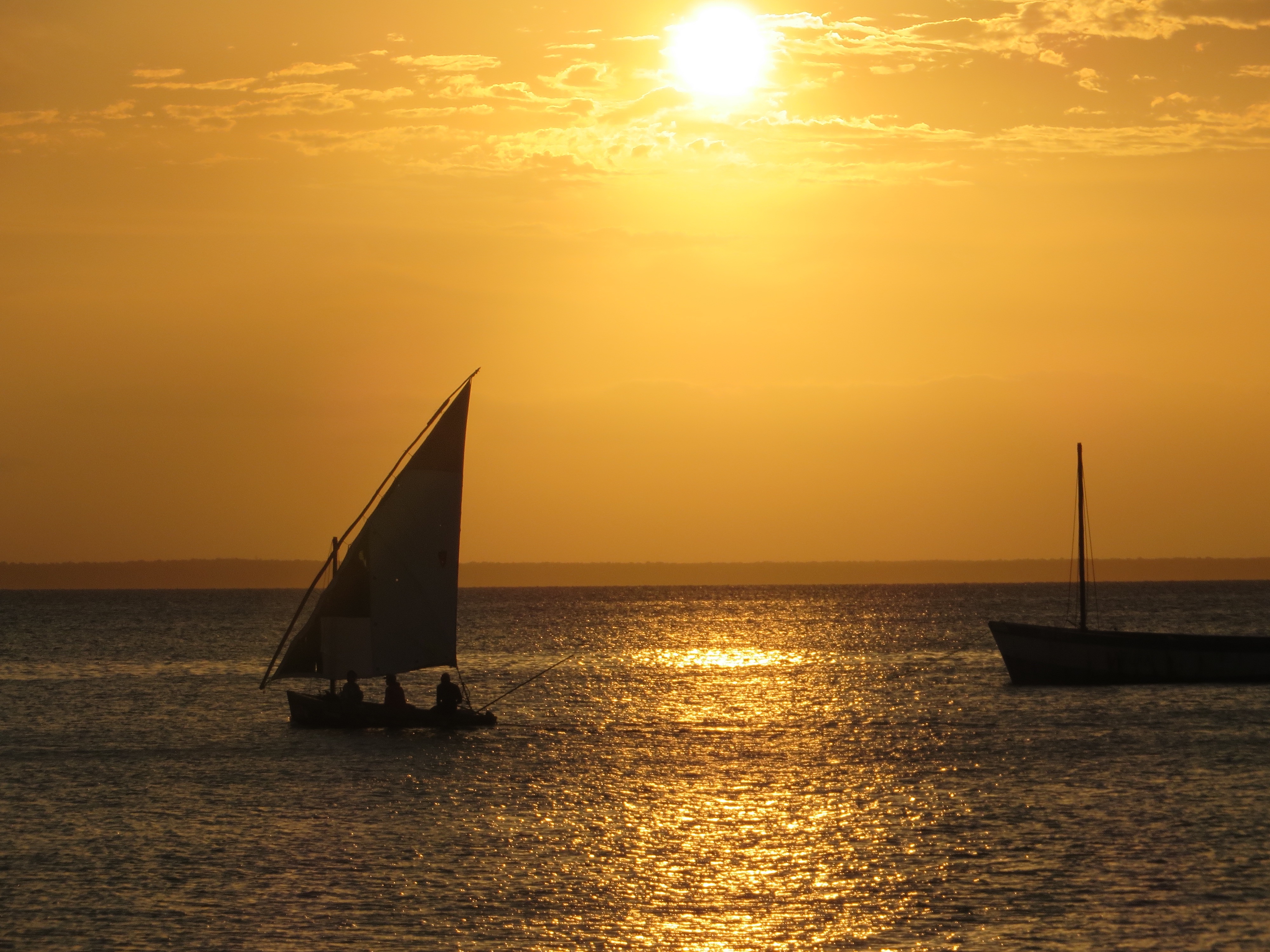 A sailboat and a Dhow, now used for fishing.