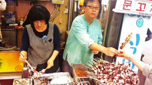 Fresh grilled octopus served on the street in Insadong, Seoul.